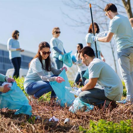 Group of People Cleaning up Outdoors
